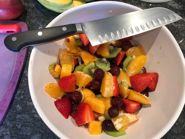 https://prudentreviews.com/wp-content/uploads/2019/07/Wusthof-Classic-Santoku-Knife-with-bowl-of-fruit.jpg