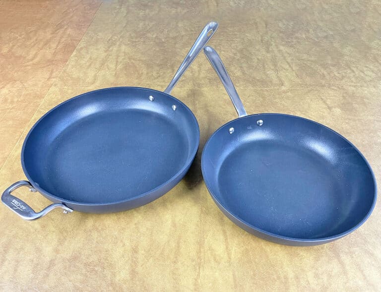 AllClad HA1 vs. Essentials 5 Key Differences Explained