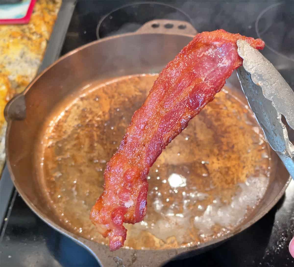 Bacon cooked in a Smithey cast iron skillet