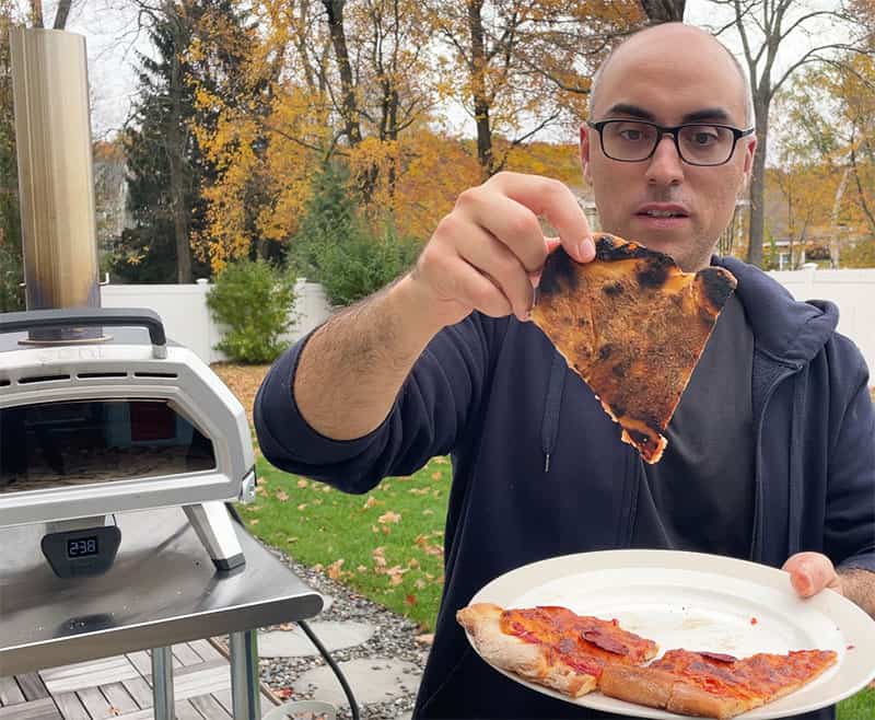 https://prudentreviews.com/wp-content/uploads/Bottom-of-a-slice-of-pizza-cooked-in-an-Ooni-pizza-oven.jpg