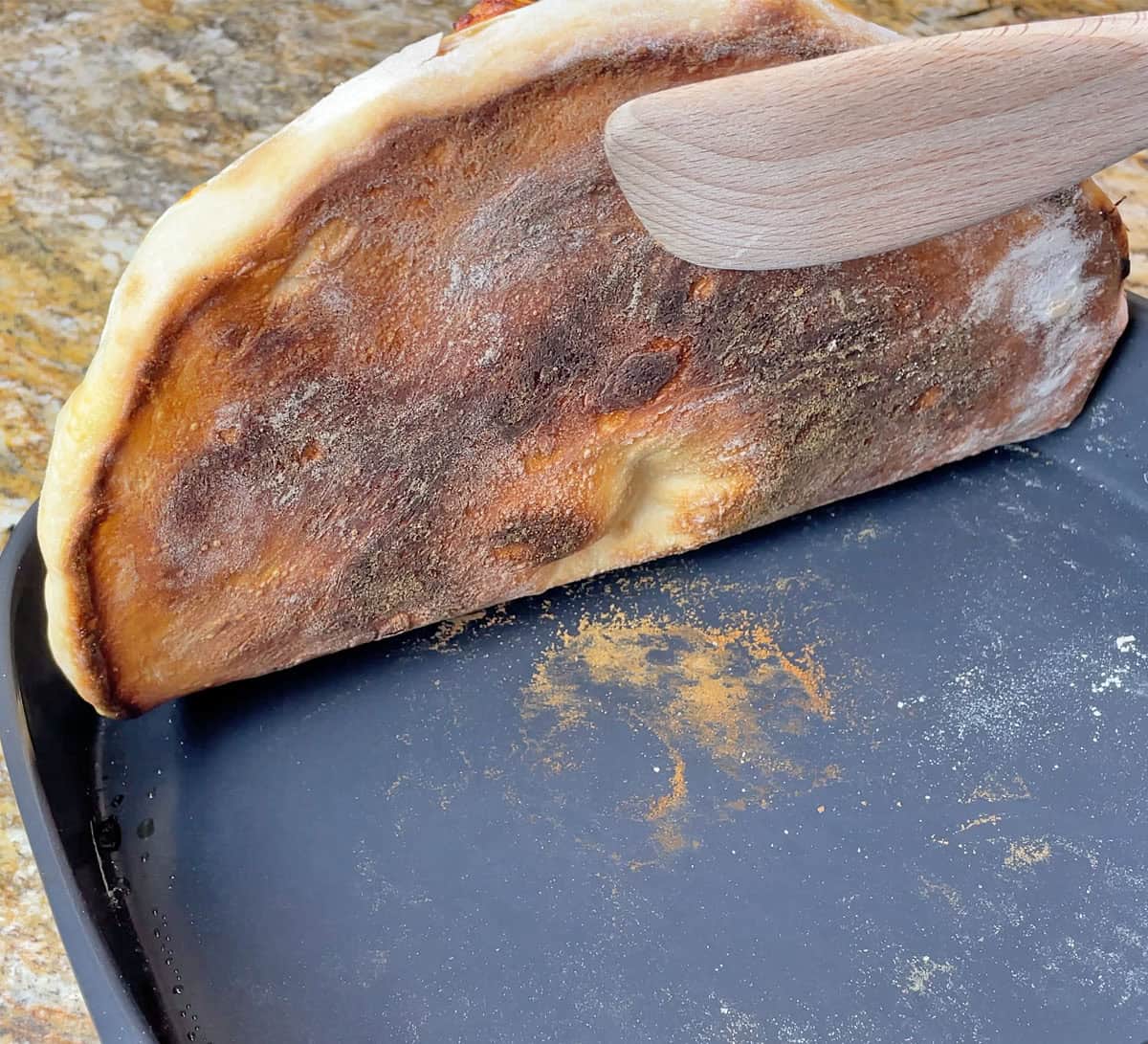 Bottom of pizza cooked in Typhur Dome 2 Air Fryer