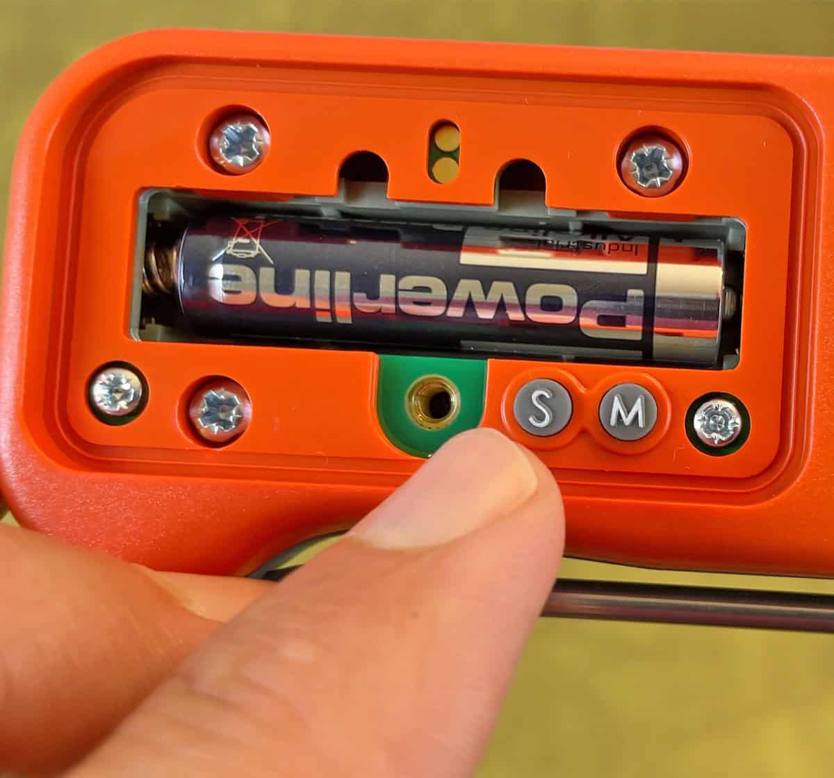 Buttons inside the battery cover of the ThermoWorks Thermapen ONE instant read thermometer