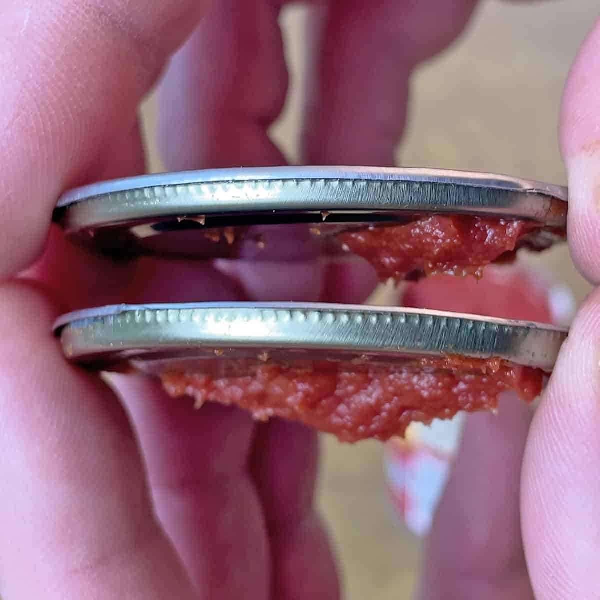 Can lids opened by OXO Smooth Edge and Kuhn Rikon Safety can openers