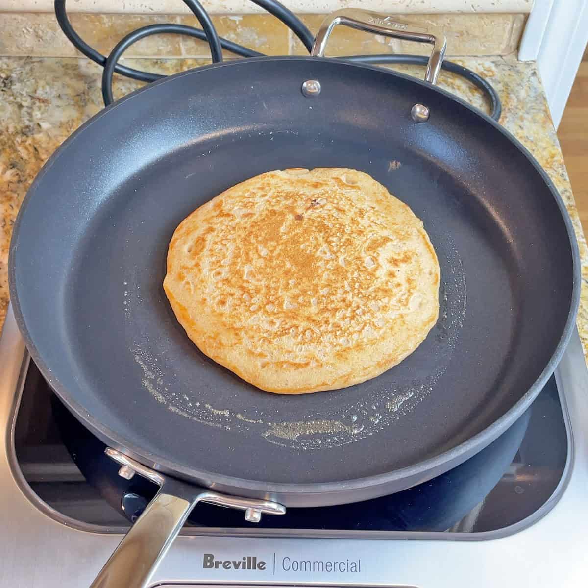Cooking a pancake on a All-Clad HA1 Expert pan on an induction cooktop