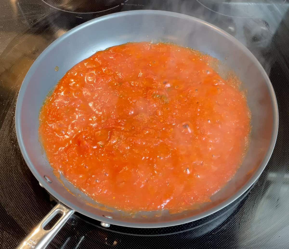 Cooking crushed tomatoes in the Misen Carbon Nonstick pan