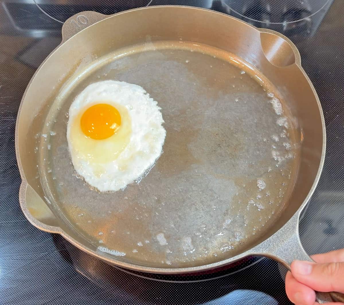Cooking egg in Lancaster cast iron skillet