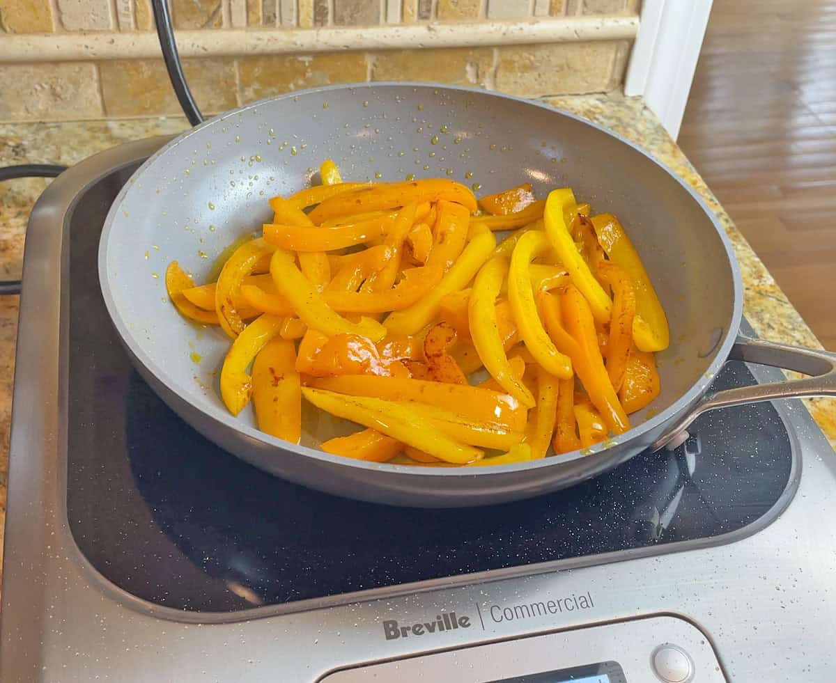 Cooking peppers on a GreenPan Valencia Pro pan on an induction cooktop