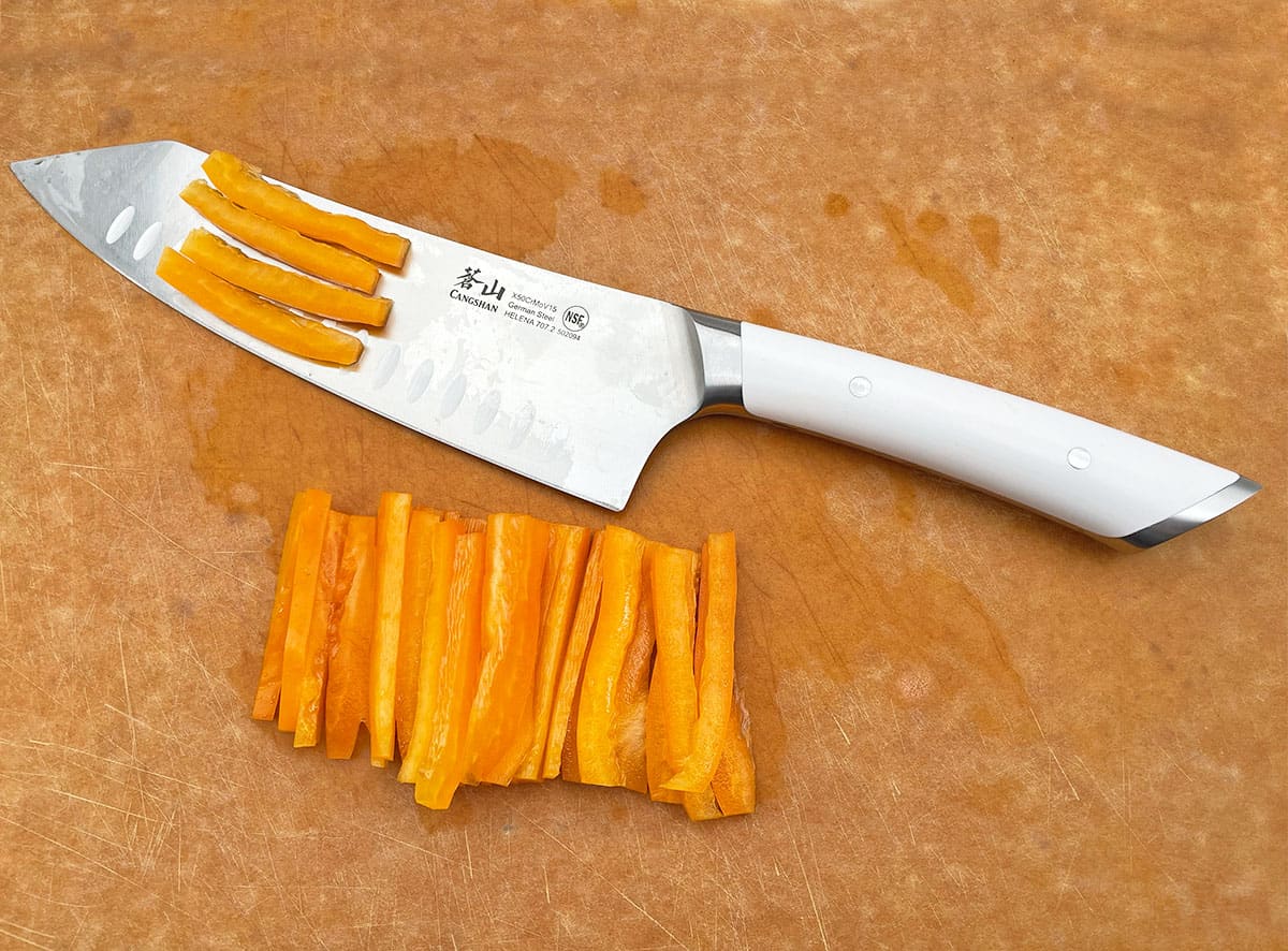 https://prudentreviews.com/wp-content/uploads/Cutting-a-bell-pepper-with-a-Cangshan-Helena-Series-Knife.jpg