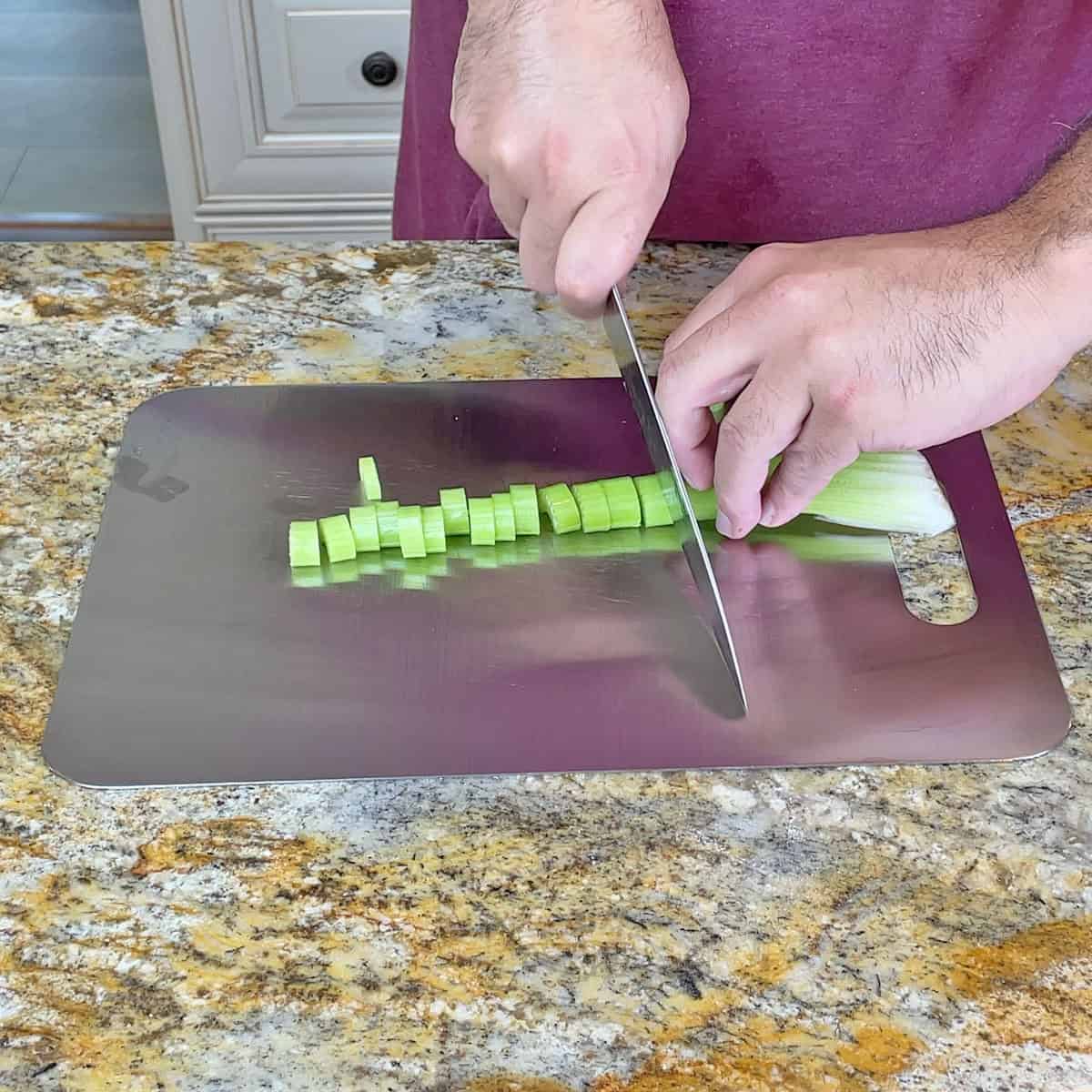 Cutting celery on a titanium cutting board