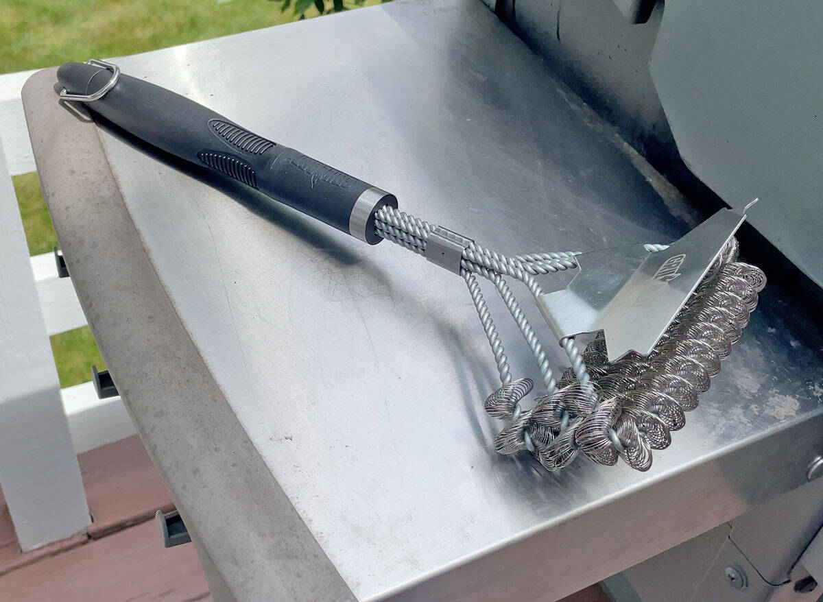 GRILLART Coil Grill Brush on a grill