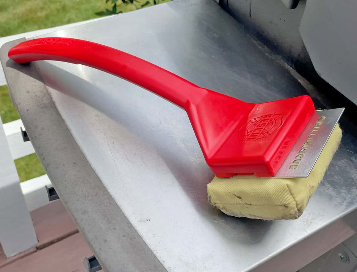 Grill Rescue grill brush with scraper on a grill