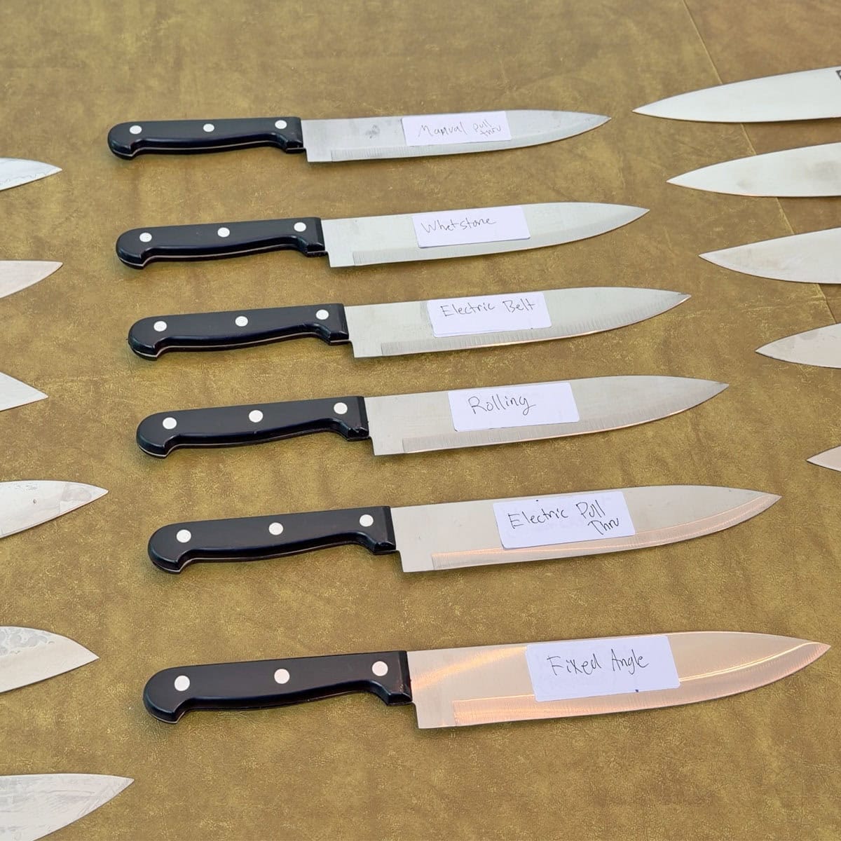 Kitchen knives sharpened during sharpener tests