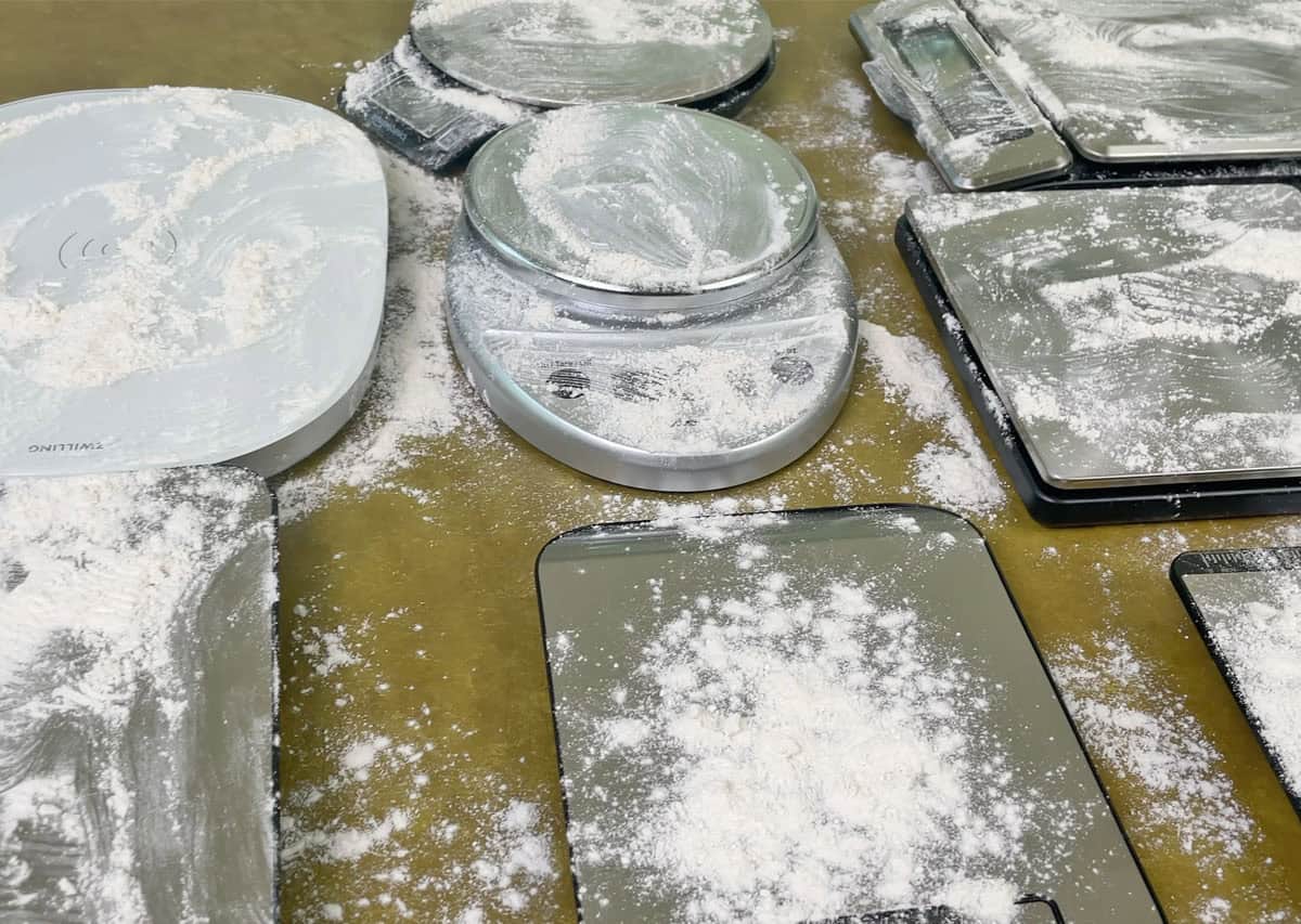 Kitchen scales covered in flour to test how easy they are to clean