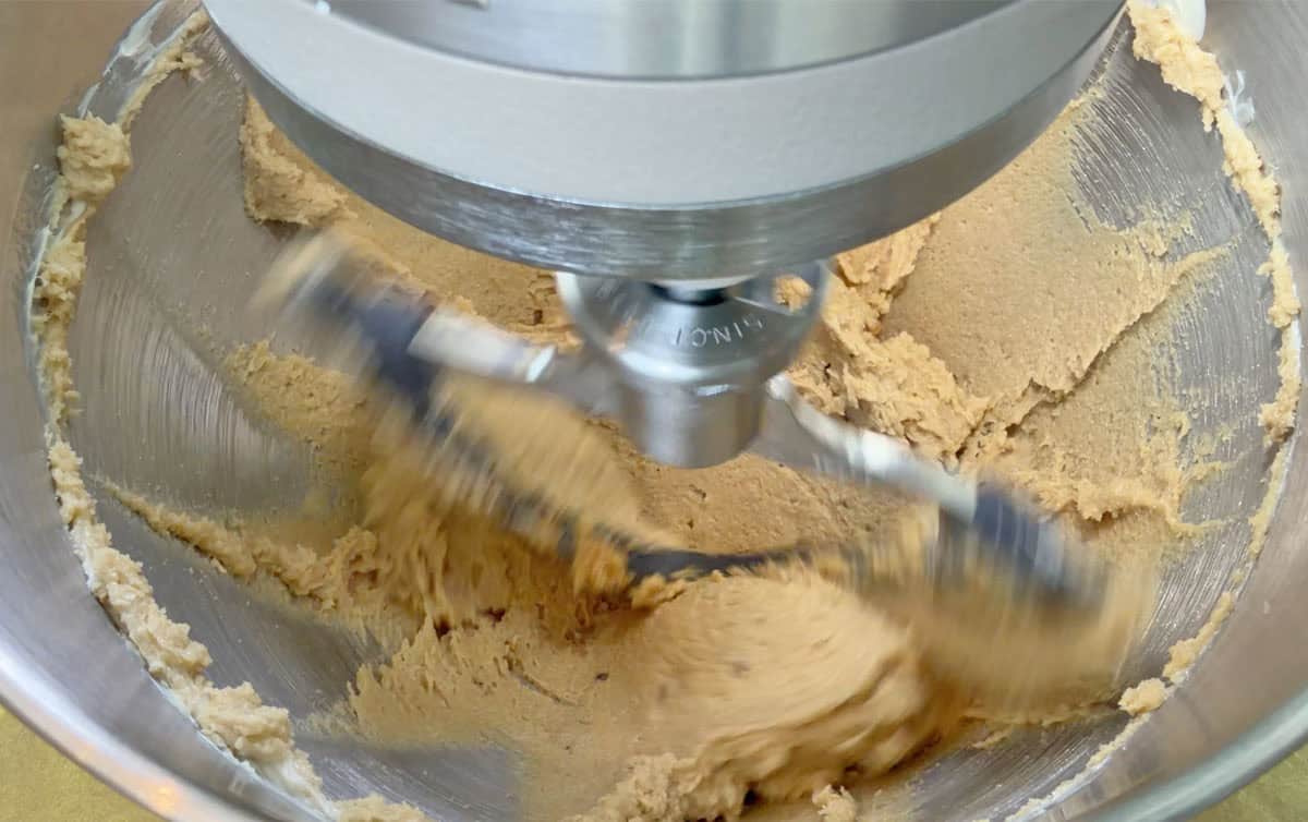 KitchenAid Artisan Plus double flex edge beater scraping cookie dough off the sides of the bowl