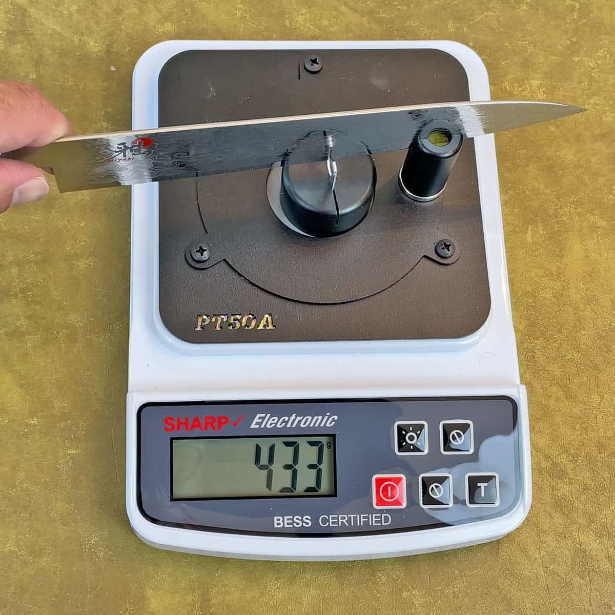 Measuring sharpness after dulling Miyabi Birchwood knife on a titanium cutting board