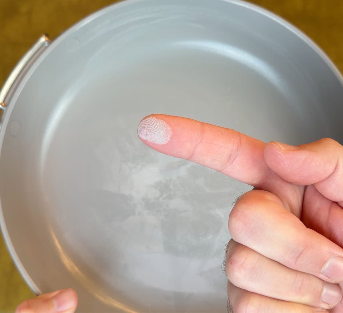 Ninja NeverStick coating sanded on finger after power sander test