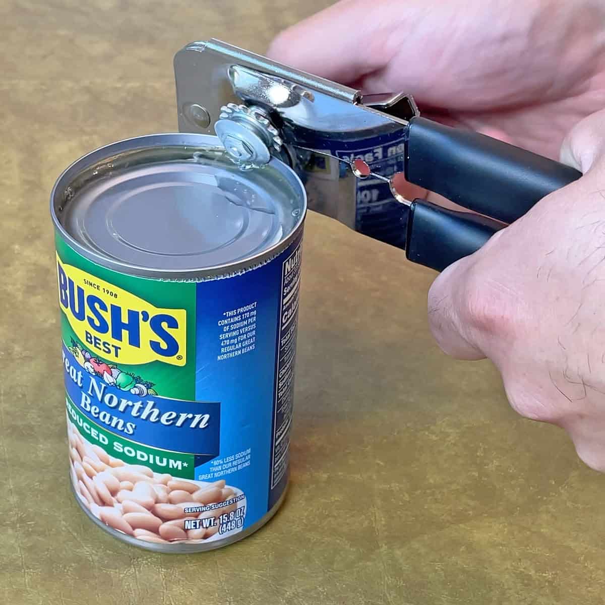 Opening a can with the EZ-DUZ-IT can opener