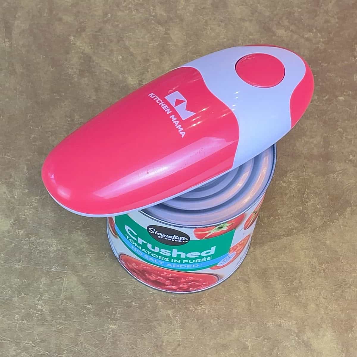 Opening a can with the Kitchen Mama can opener