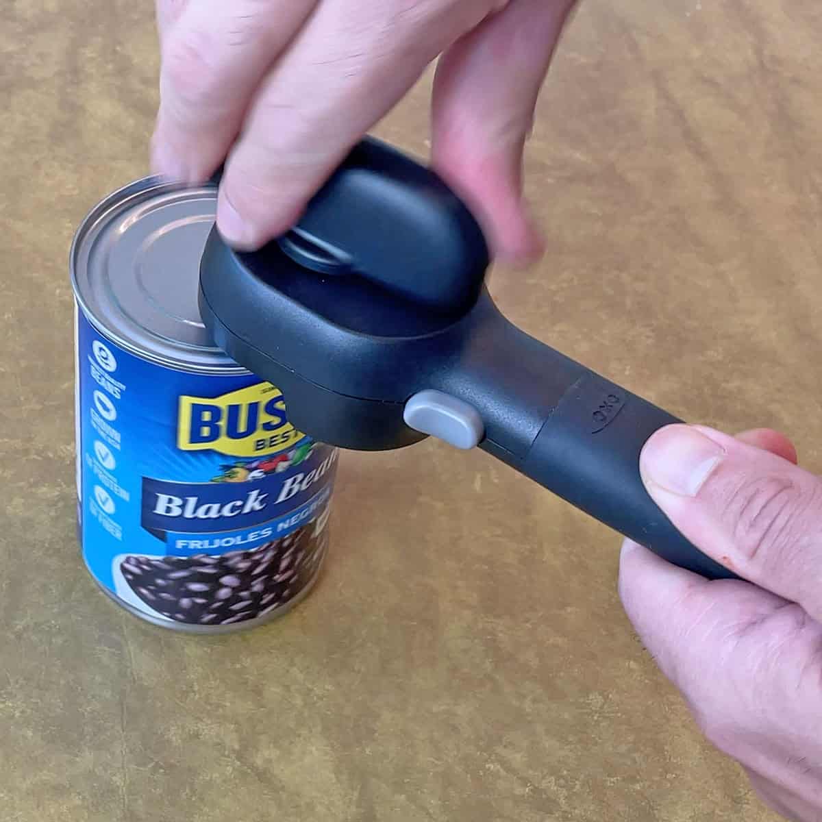 Opening a can with the OXO Smooth Edge can opener