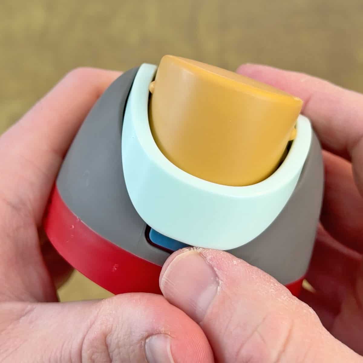 Owala FreeSip handle locking the lid and preventing the button from being pressed