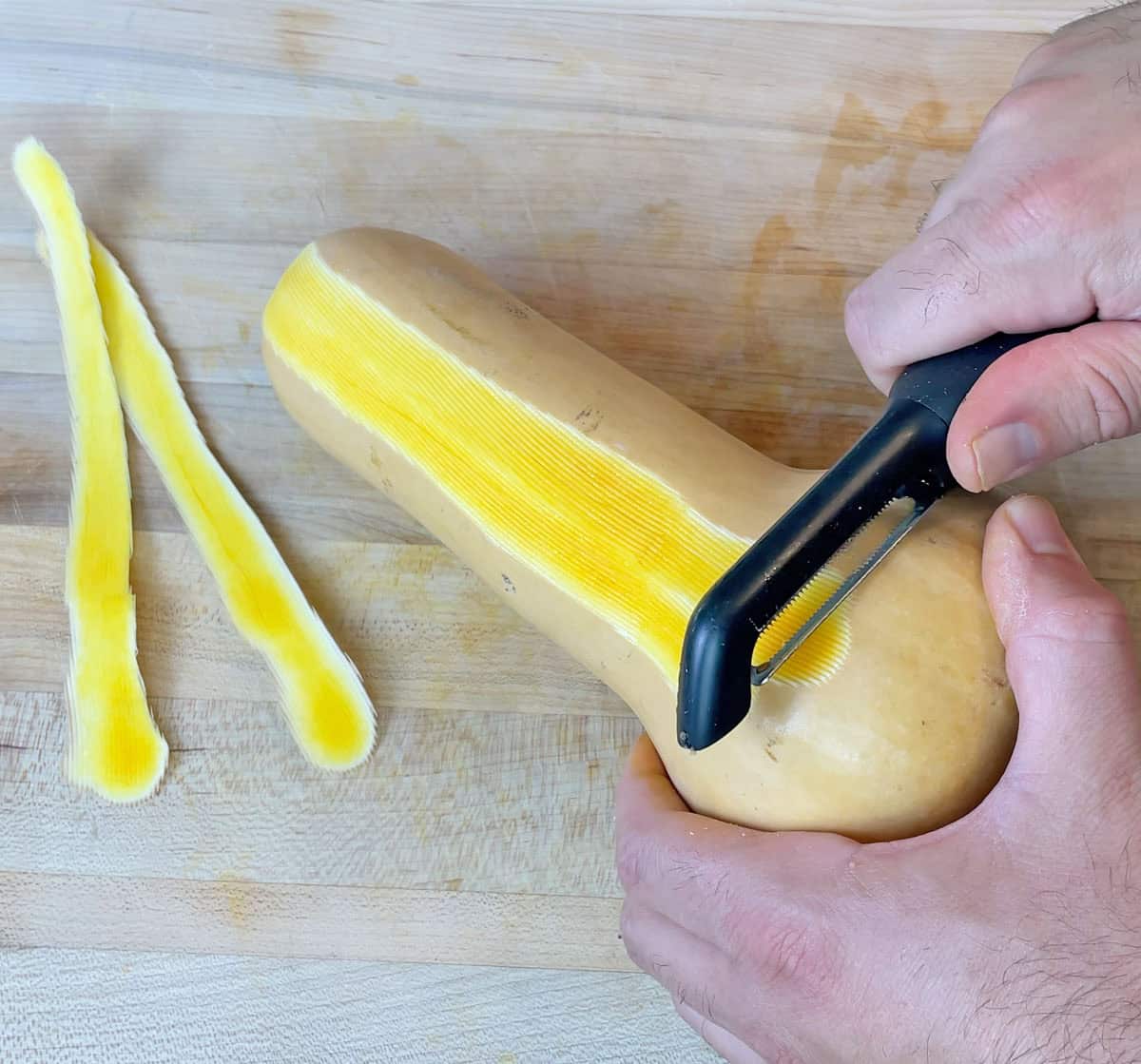 Peeling a butternut squash with the OXO Serrated Peeler