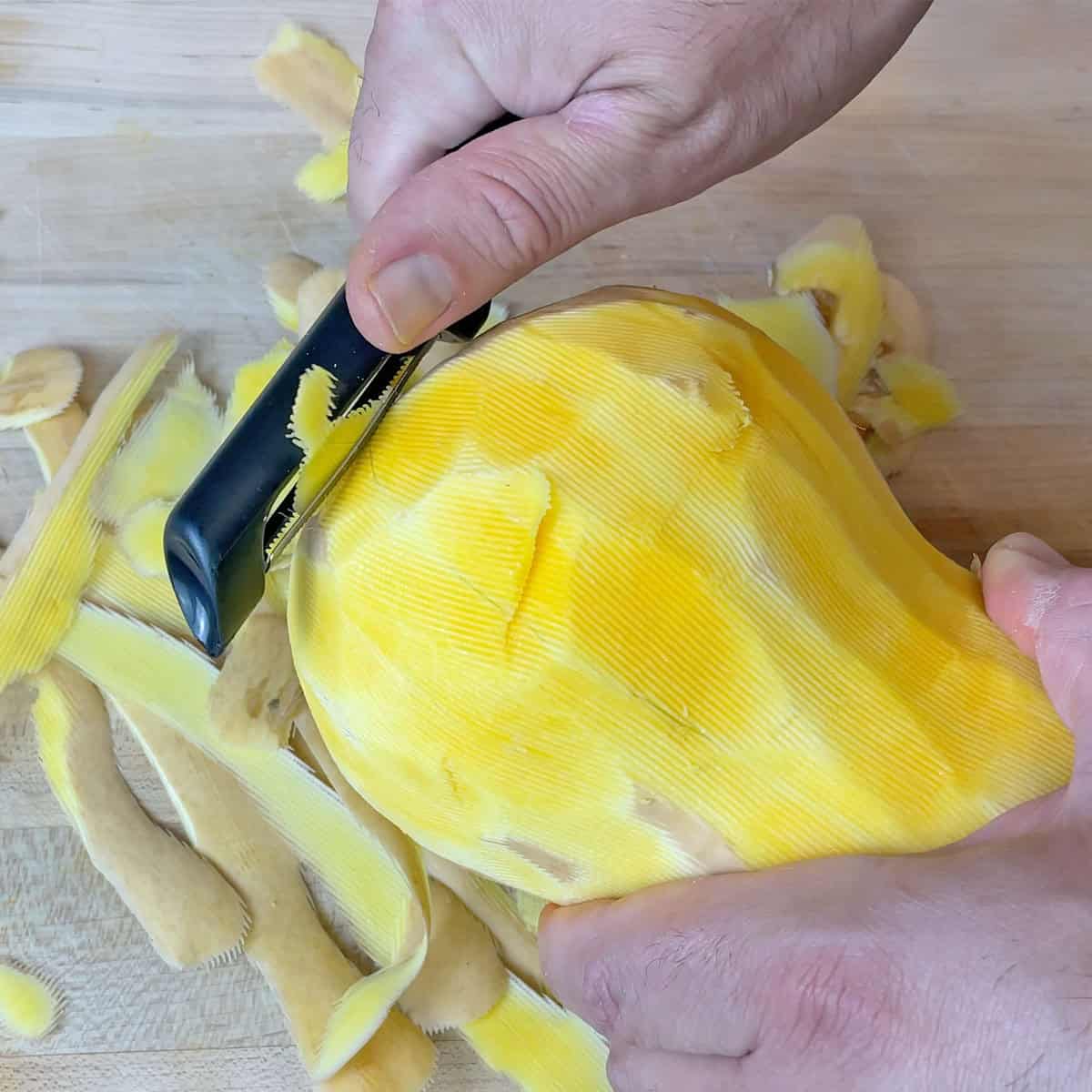 Peeling chunks out of a butternut squash with KitchenAid Euro Peeler