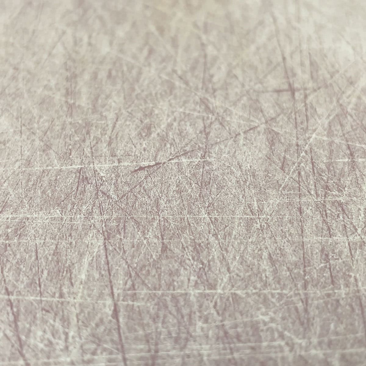 Scars and groove on a plastic cutting board