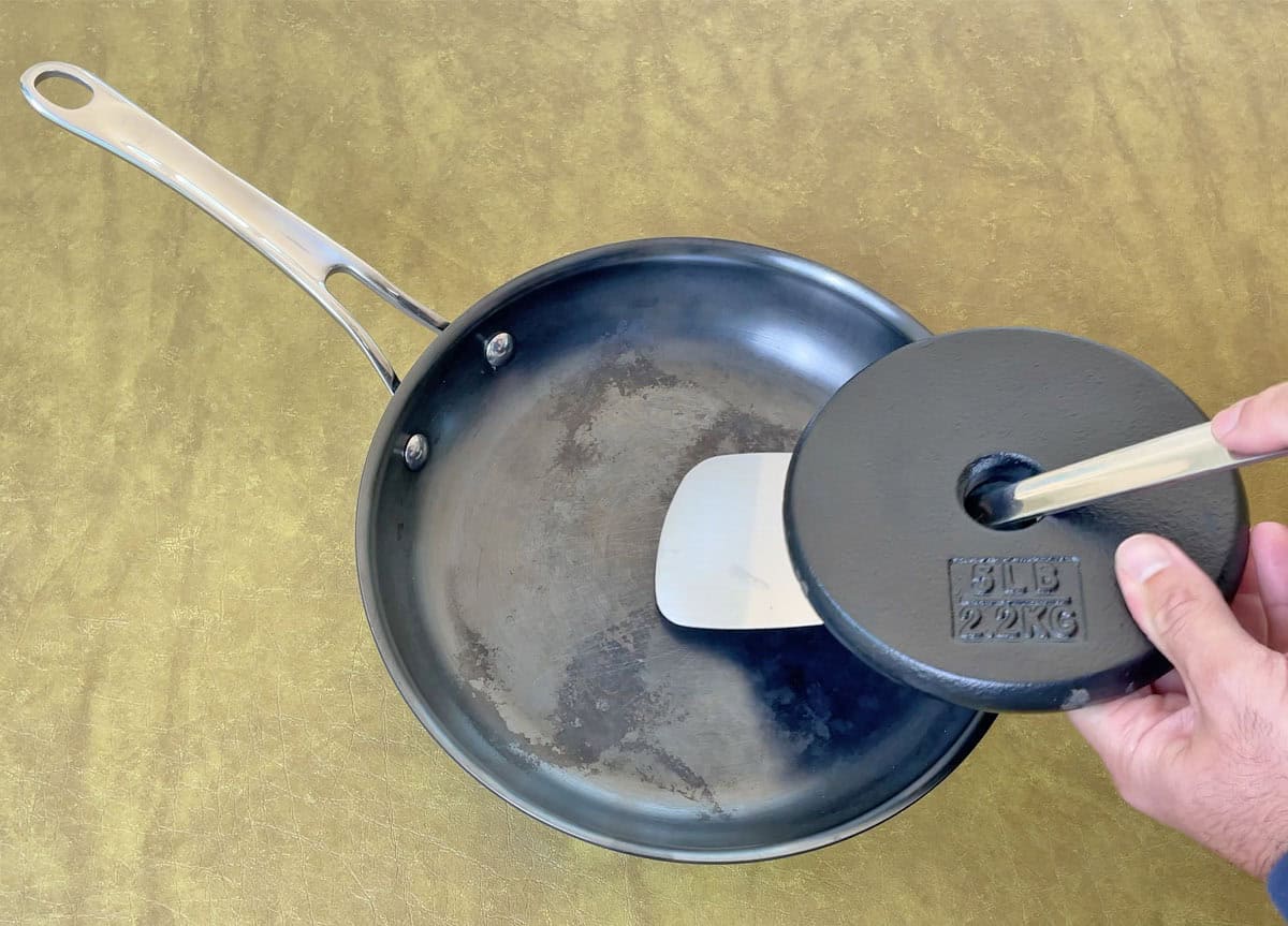 Scraping the Anolon EverLast N2 pan with a metal spatula