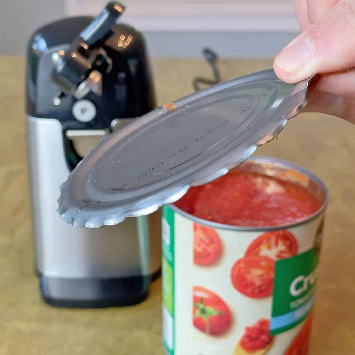 Sharp can lid after opening with Amazon Basics electric can opener