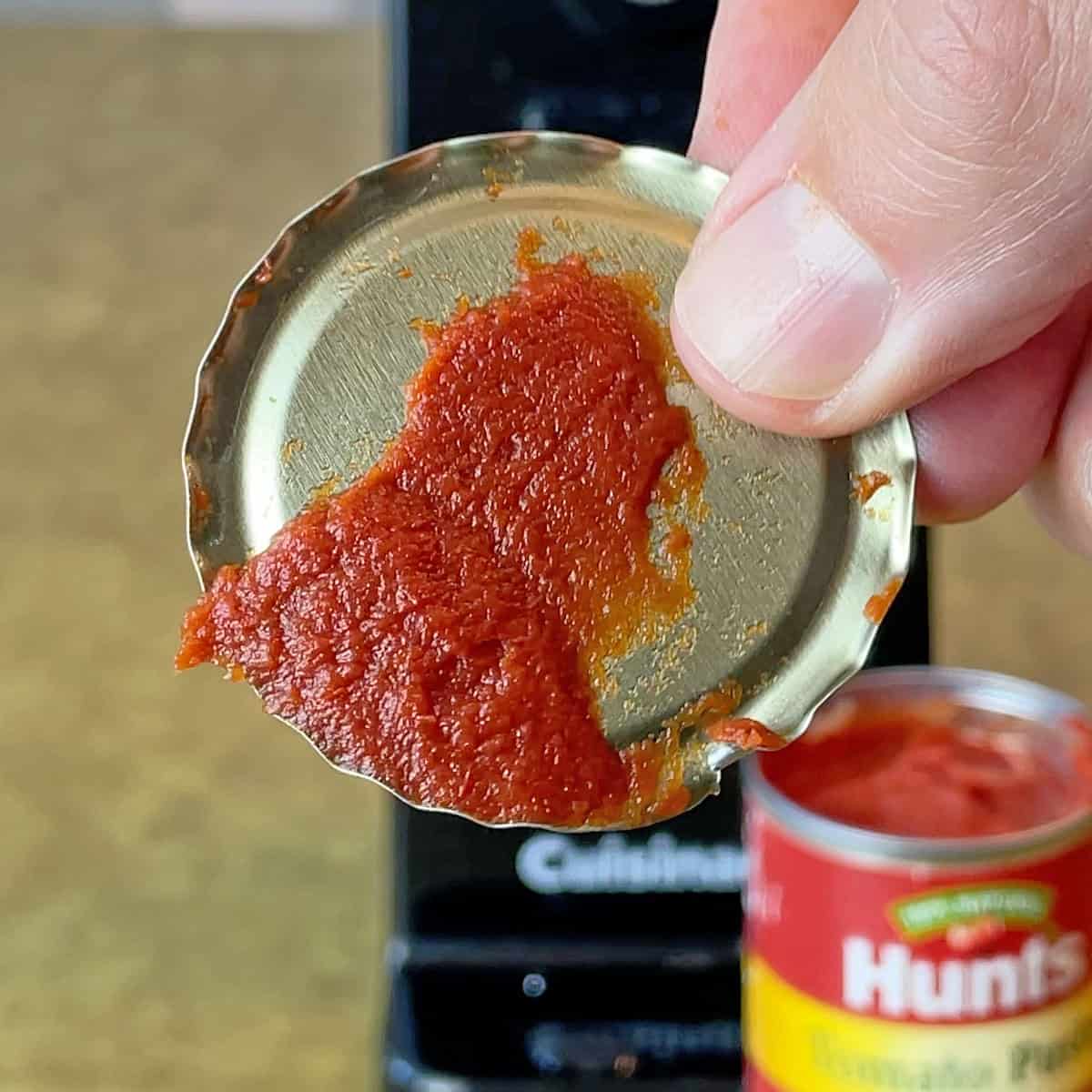 Sharp can lid after opening with Cuisinart Deluxe electric can opener