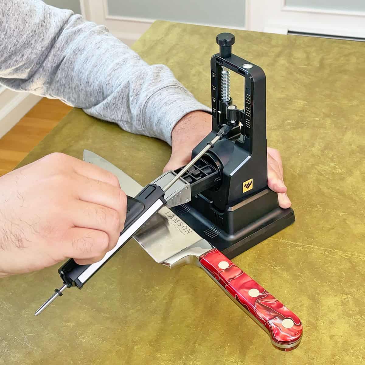 Sharpening a knife with a fixed angle sharpener