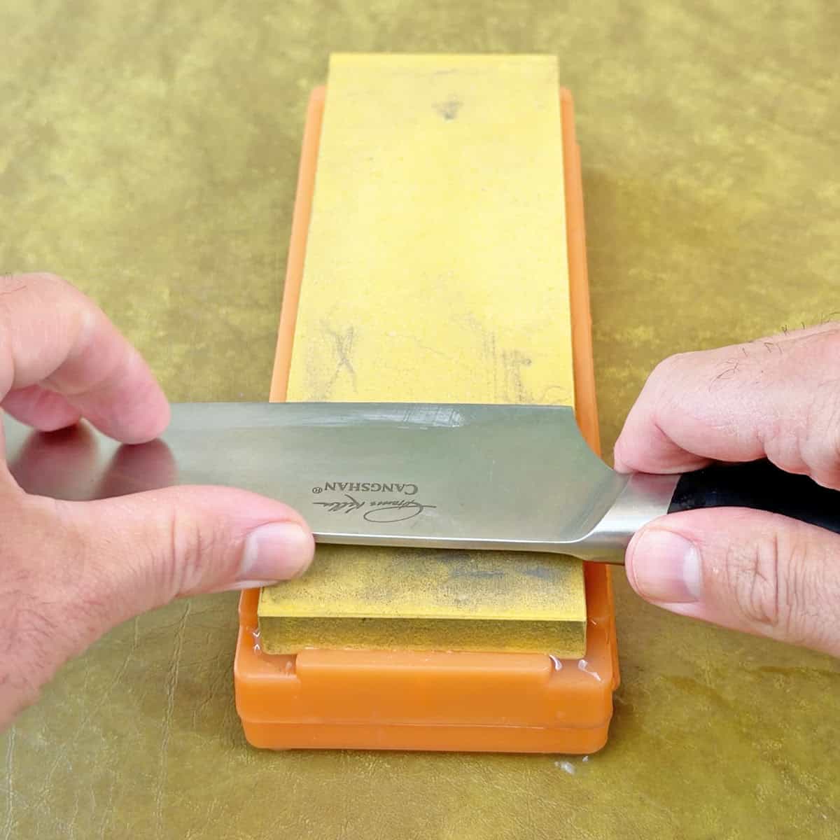 Sharpening a knife with a whetstone