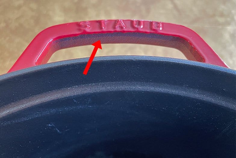 Staub Dutch oven handles with bare cast iron exposed