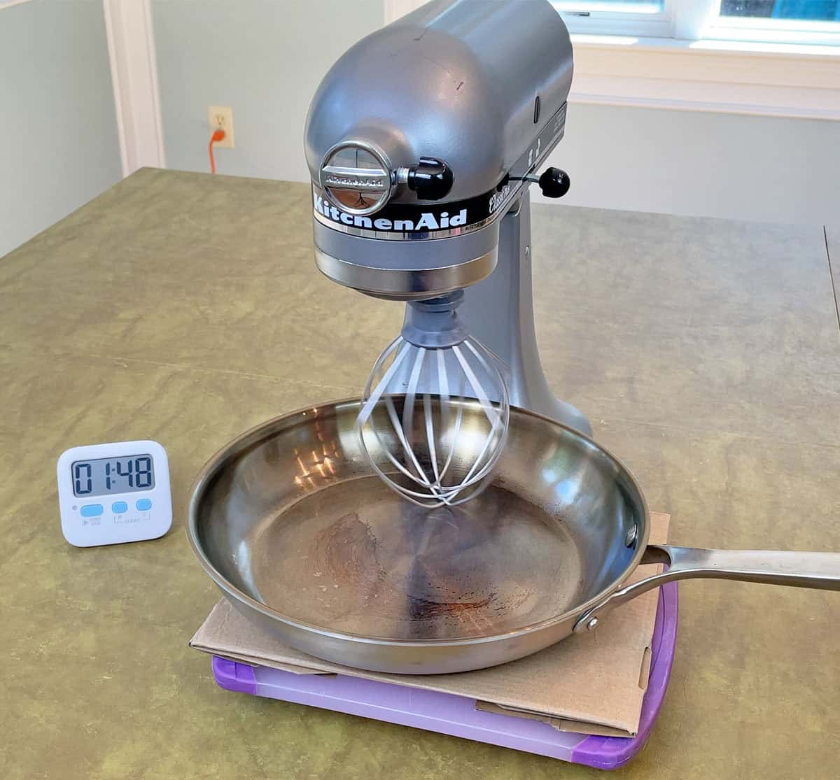 Testing Strata pan durability with a metal whisk