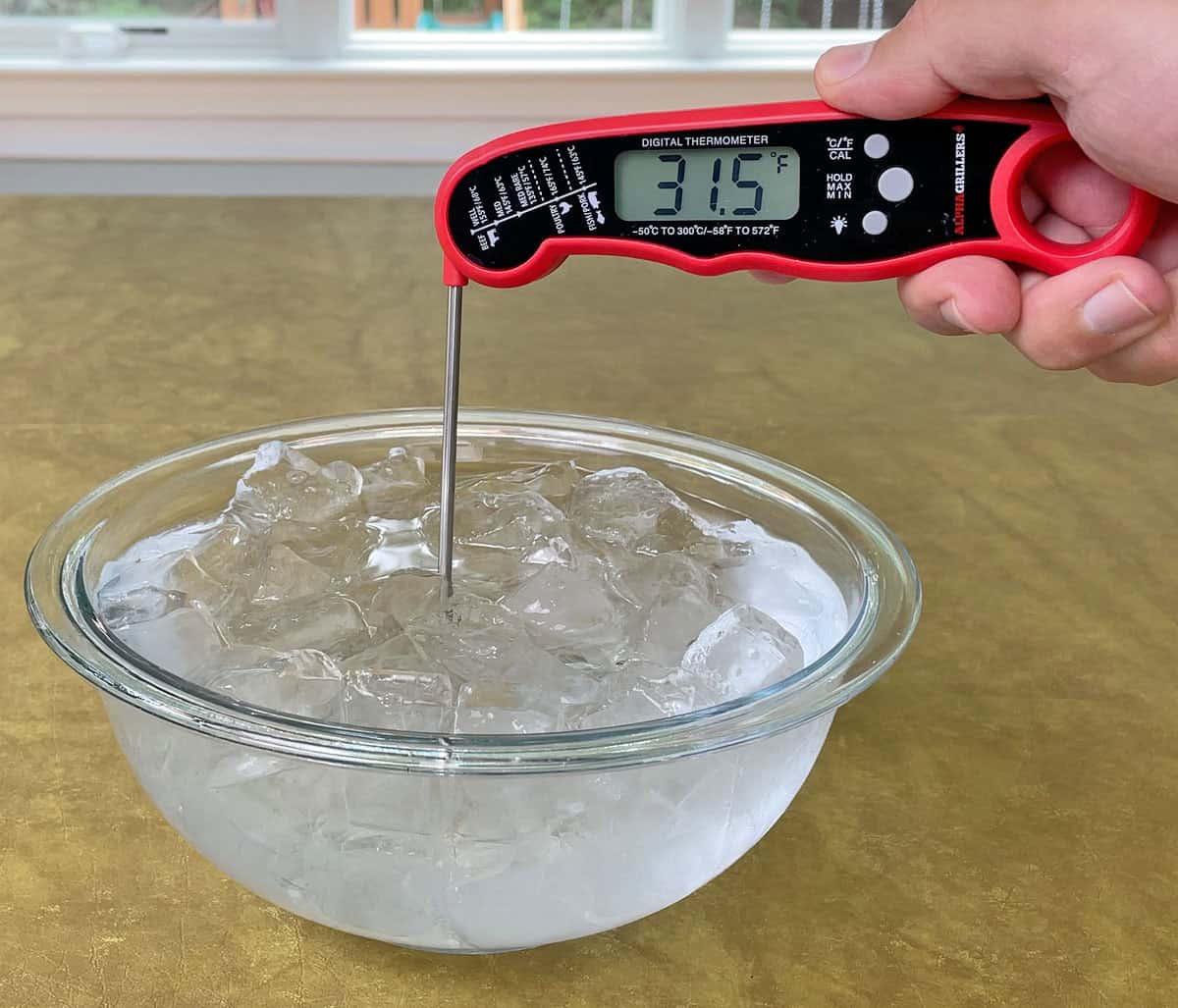 Testing the Alpha Grillers instant read thermometer in an ice bath