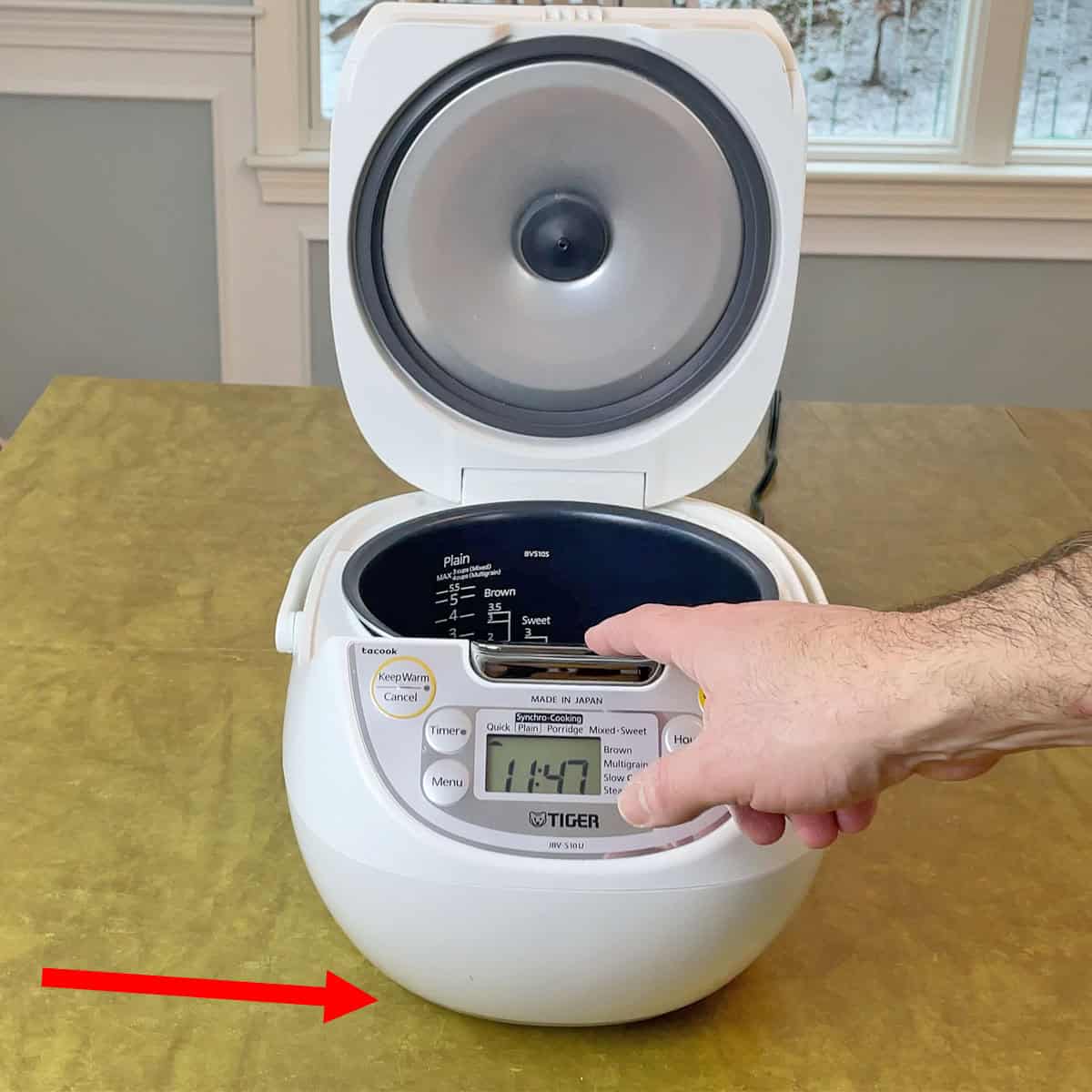 Tiger rice cooker lifting off counter when lift opens